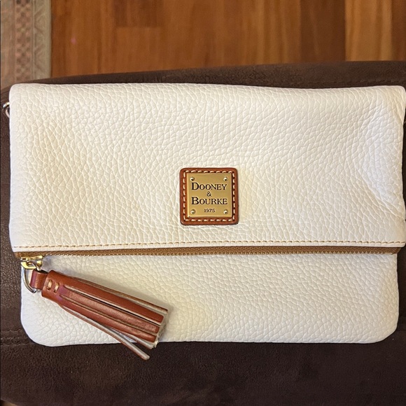 Dooney & Bourke Handbags - Dooney & Bourke White Pebbled Leather Foldover Clutch